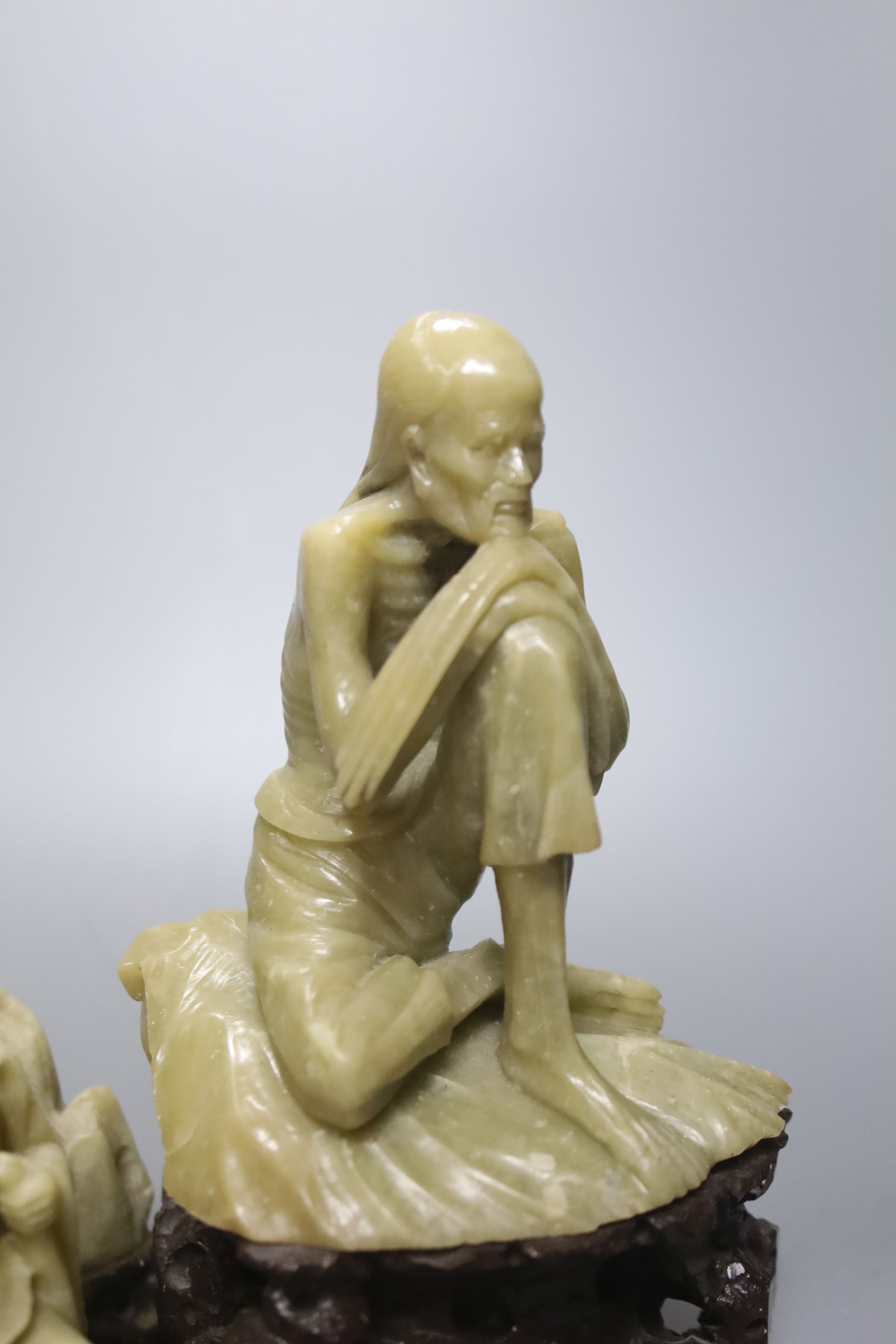 Seven Chinese soapstone carvings, 4 figurative carvings, largest 26 cms high including base.